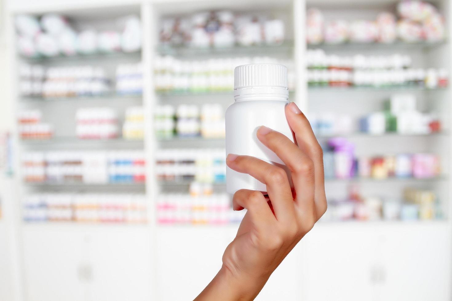 Medicine bottle in the hand of a doctor photo