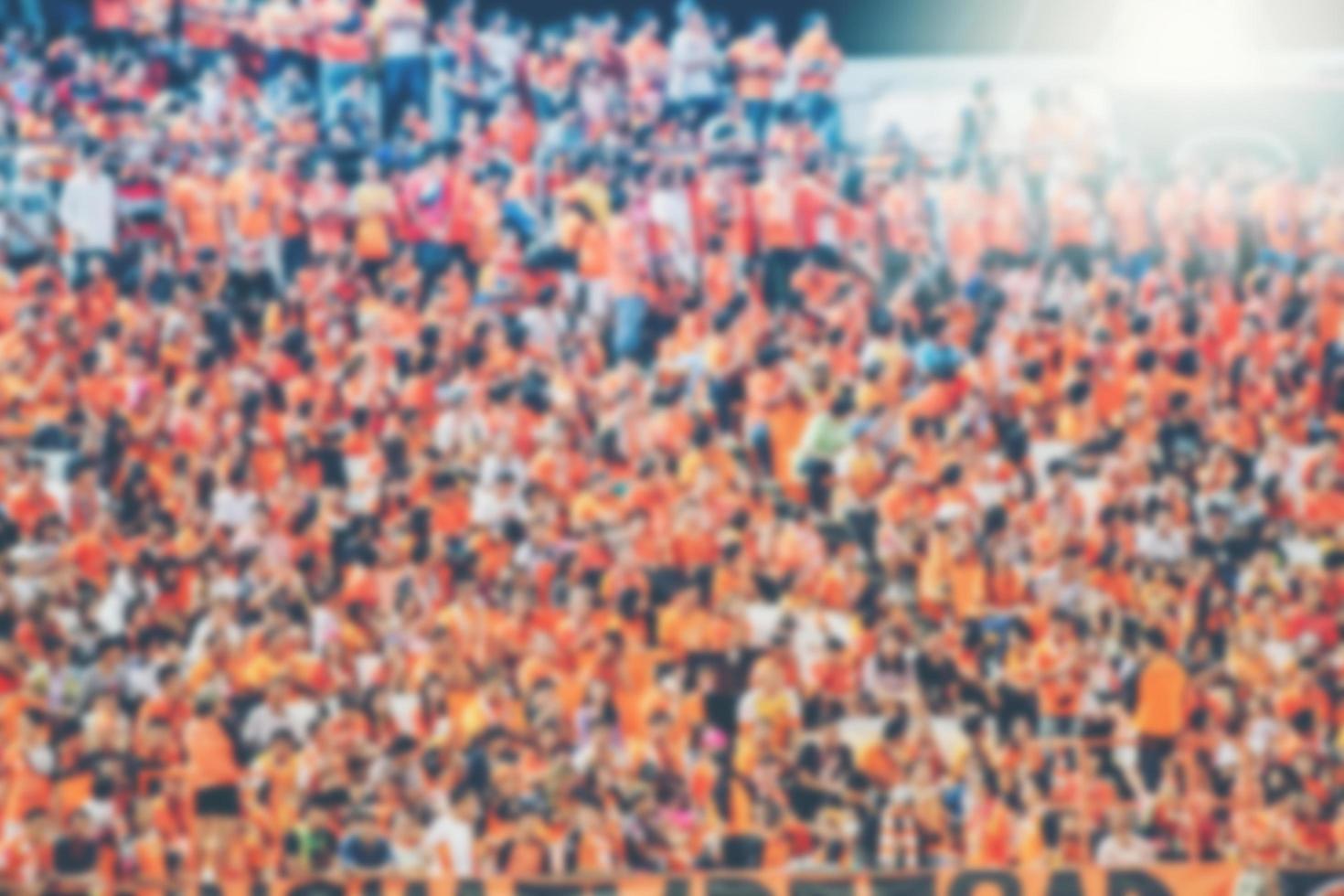 Blurry soccer fan background photo