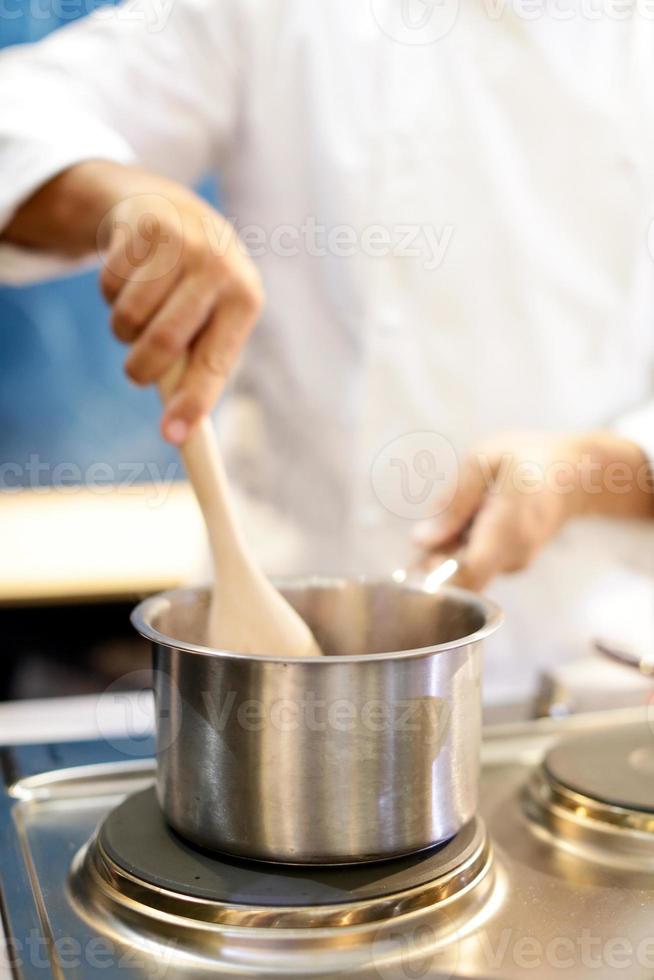 Chef cooking food in the kitchen, Chef preparing food photo