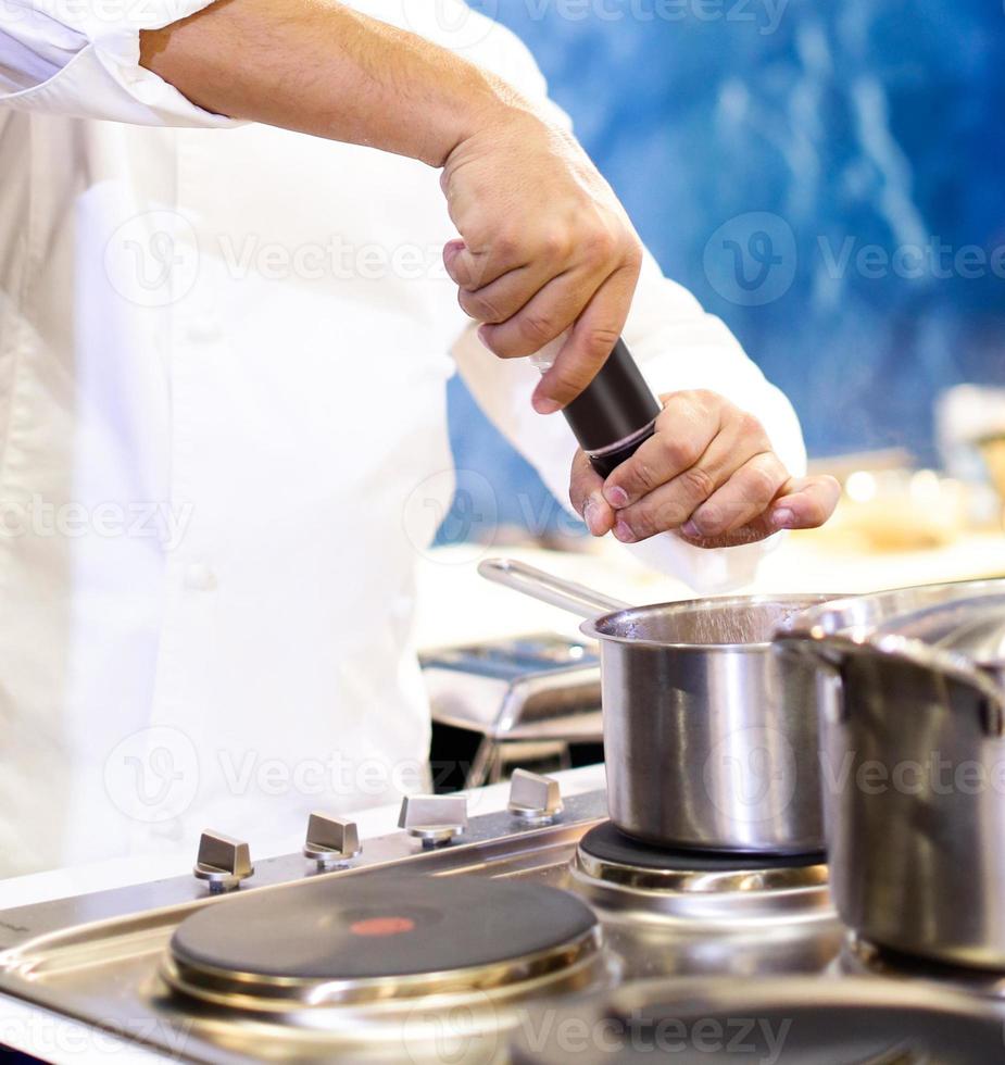 Chef cooking food in the kitchen, Chef preparing food photo