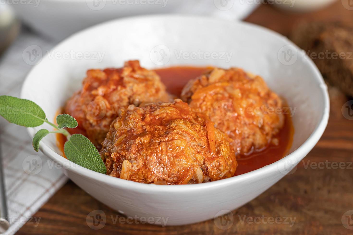 Meat balls on a wooden background with sage photo