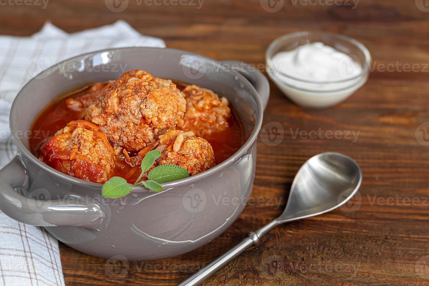 Meat balls on a wooden background with sage photo