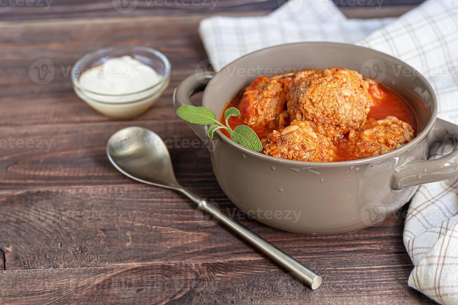 Meat balls on a wooden background with sage photo