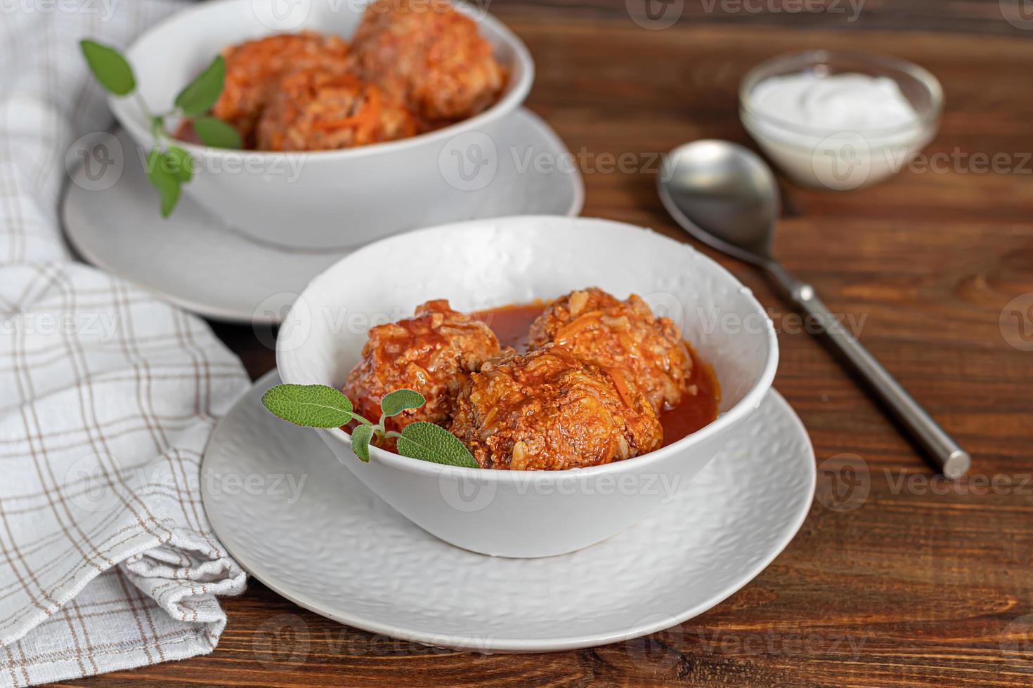 Meat balls on a wooden background with sage photo