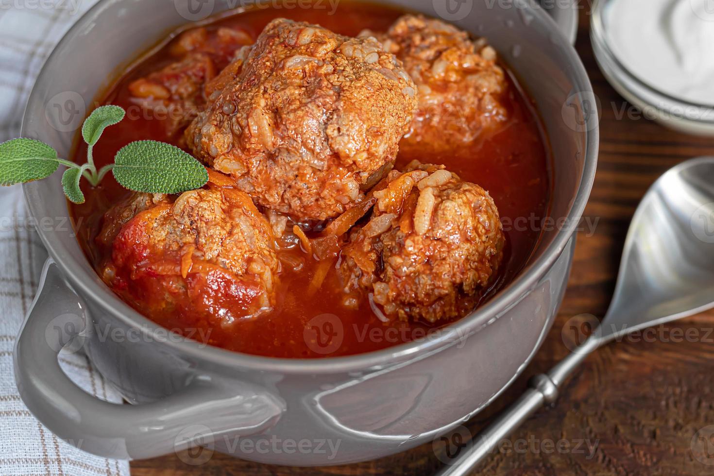 Meat balls on a wooden background with sage photo