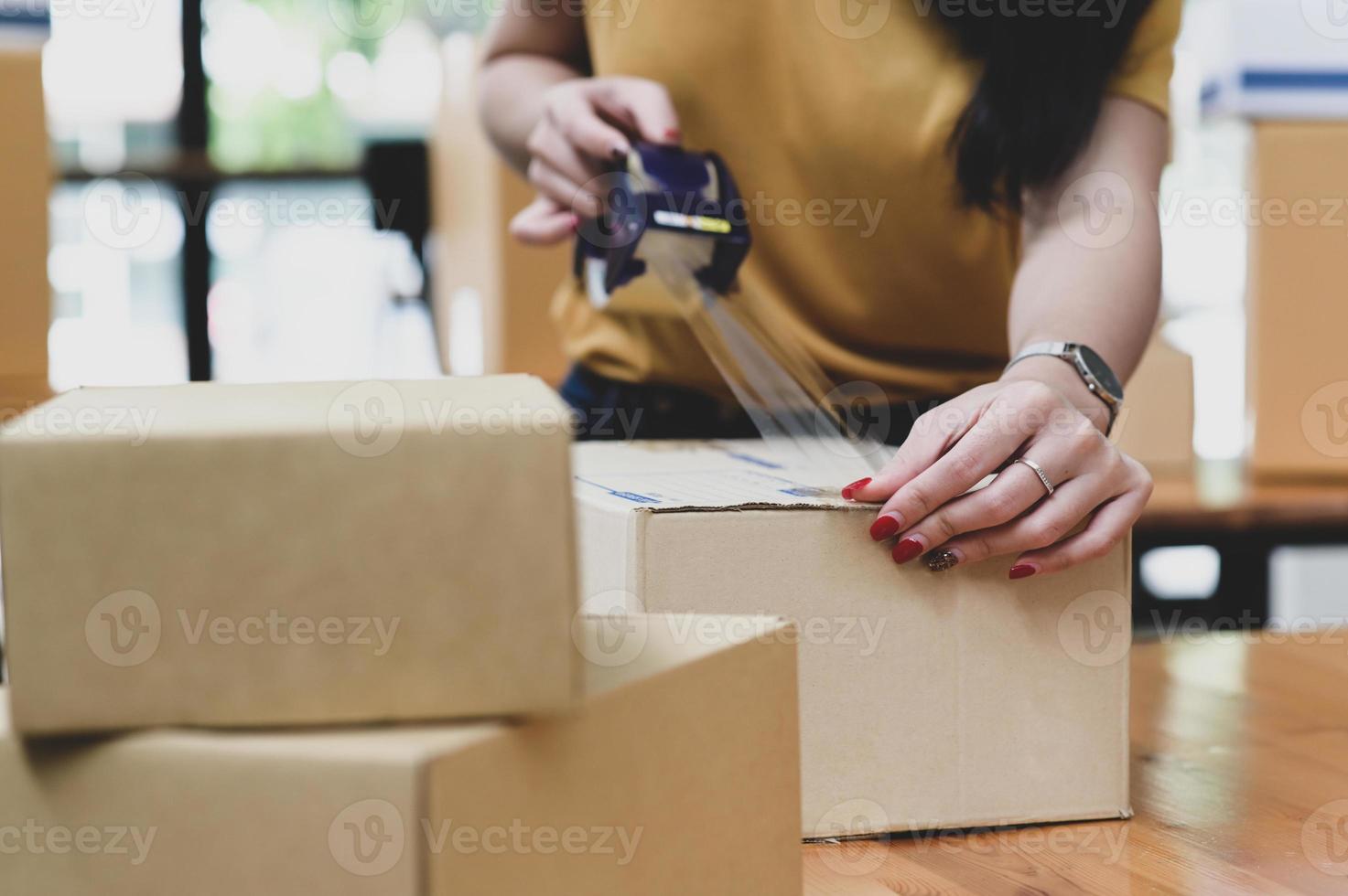 Parcel delivery workers are packing boxes, Tansporting. photo