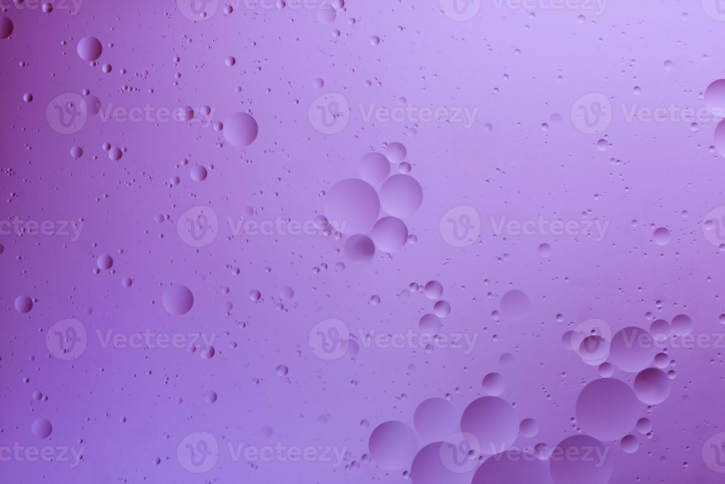 Water and oil, color abstract background based on pink and lilac color circles and ovals, macro abstraction, real photo. photo