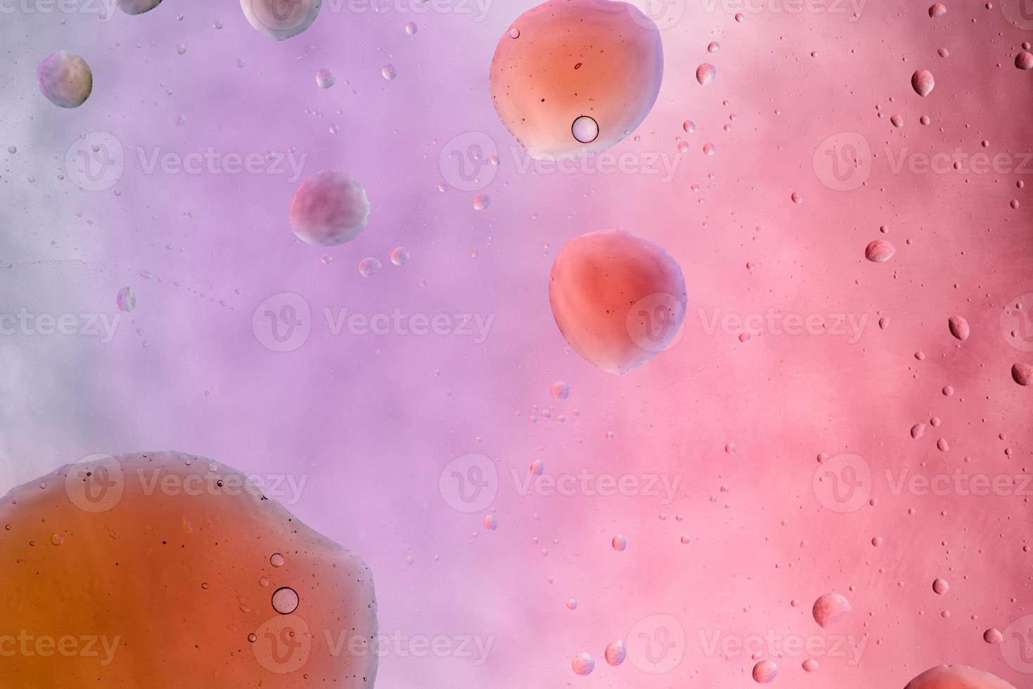 Water and oil, color abstract background based on pink, rose, purple and yellow color circles and ovals, macro abstraction, real photo. photo