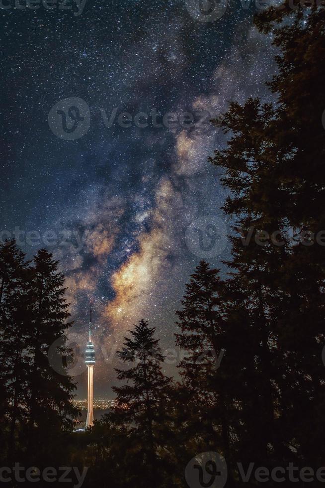 Milky Way galaxy over the Avala tower between huge pine tree forest, Avala, Belgrade, Serbia, Europe. photo