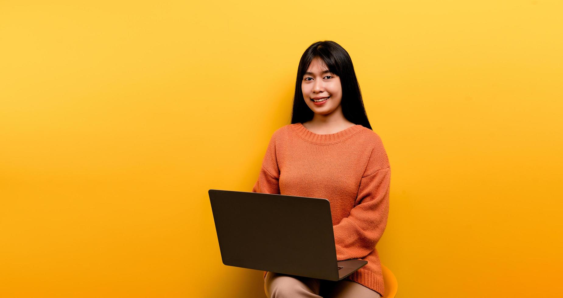 Asian woman and laptop and are happy to work Photo