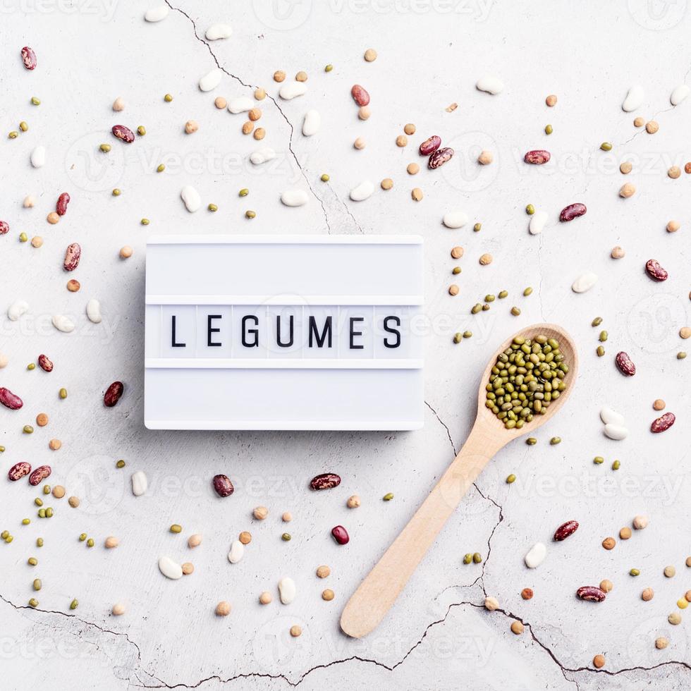 legumes with lightbox with the text Legumes top view flat lay photo