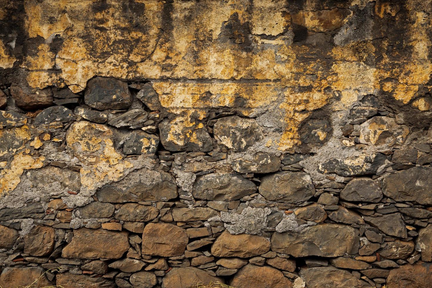 Old wall, built of rough brick photo