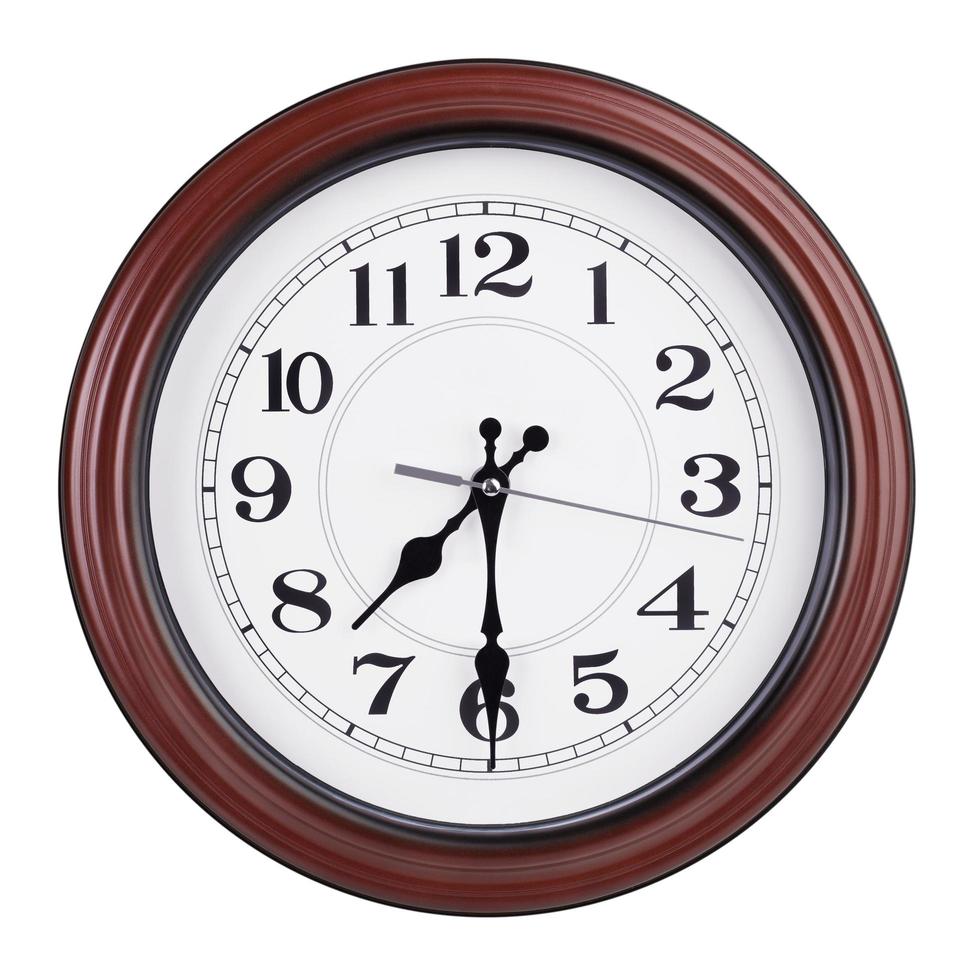 Round clock shows half past seven photo