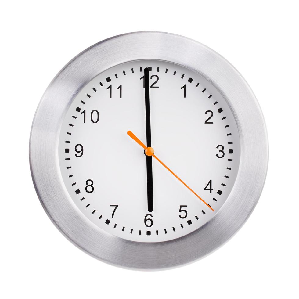 Exactly six o'clock on a round clock photo
