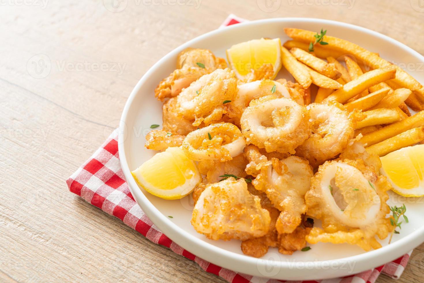 calamari - fried squid or octopus with fries photo