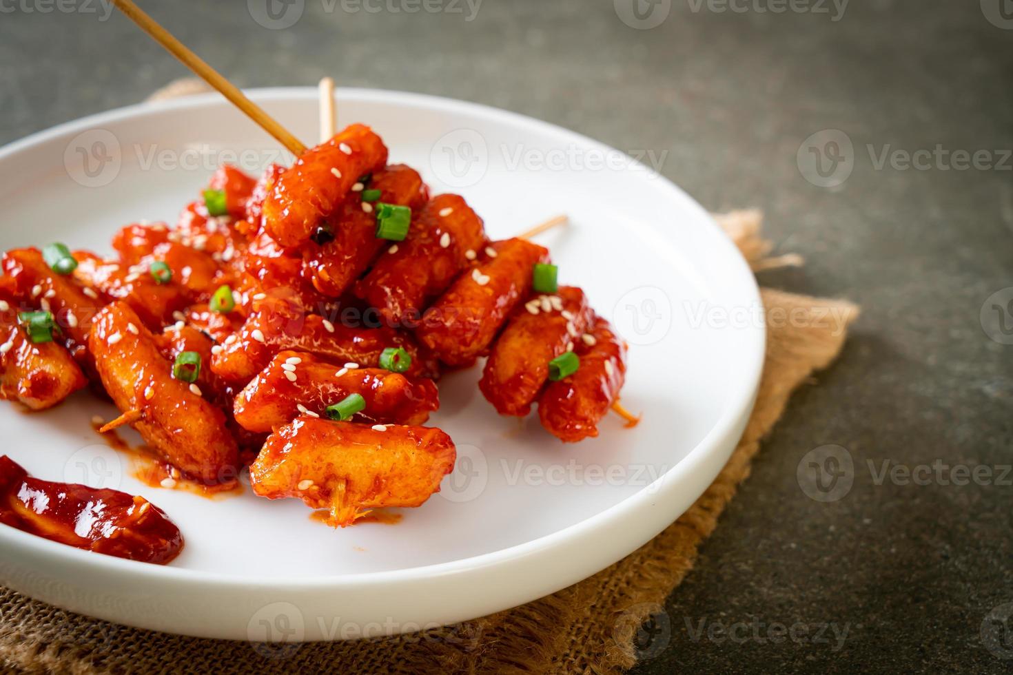 deep fried Korean rice cake skewered with spicy sauce photo