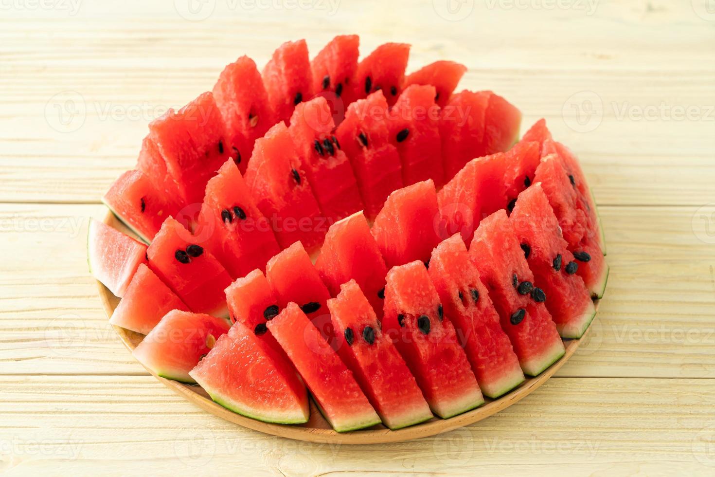 fresh watermelon sliced on plate photo