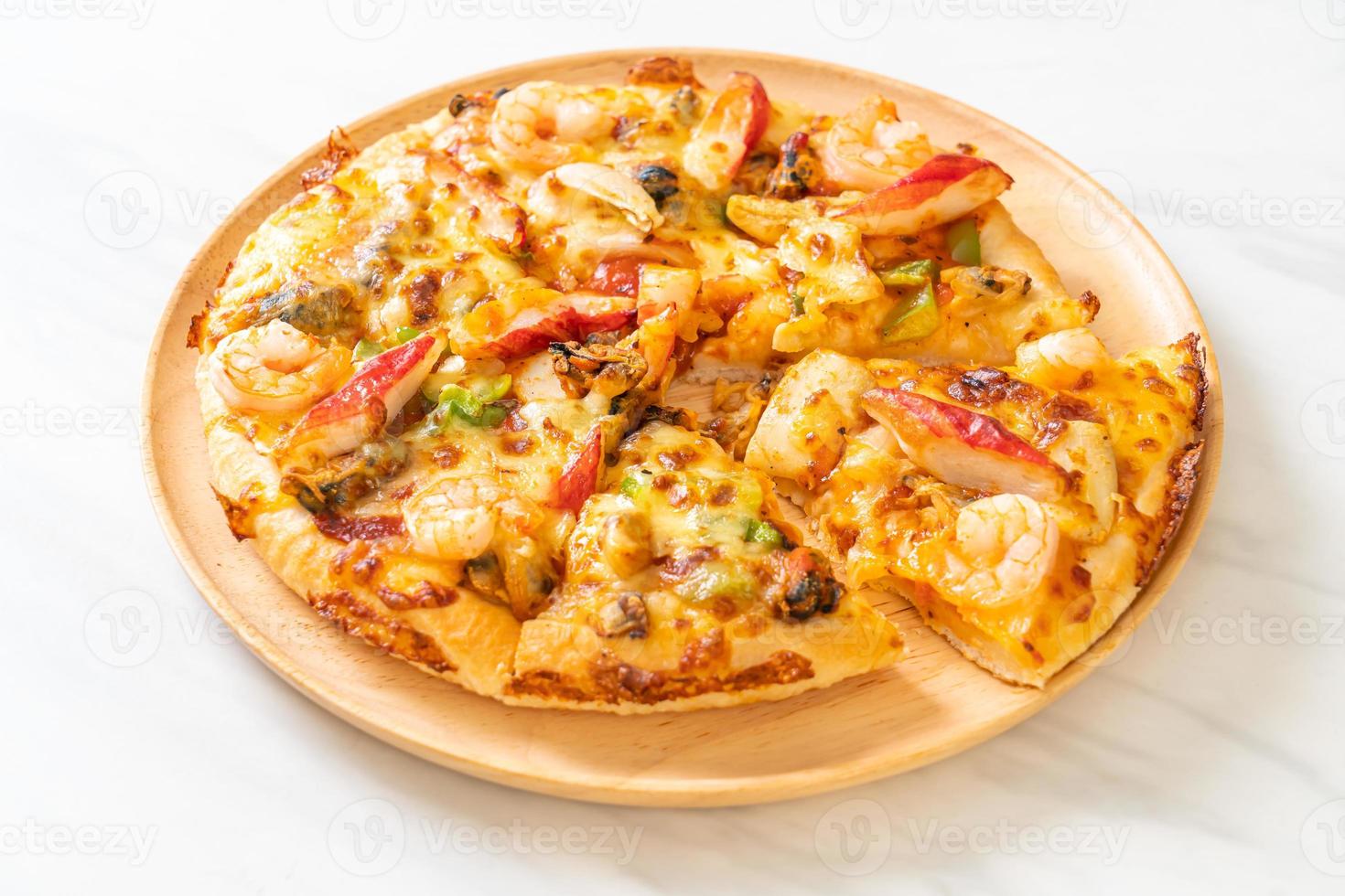 seafood pizza on wood tray photo