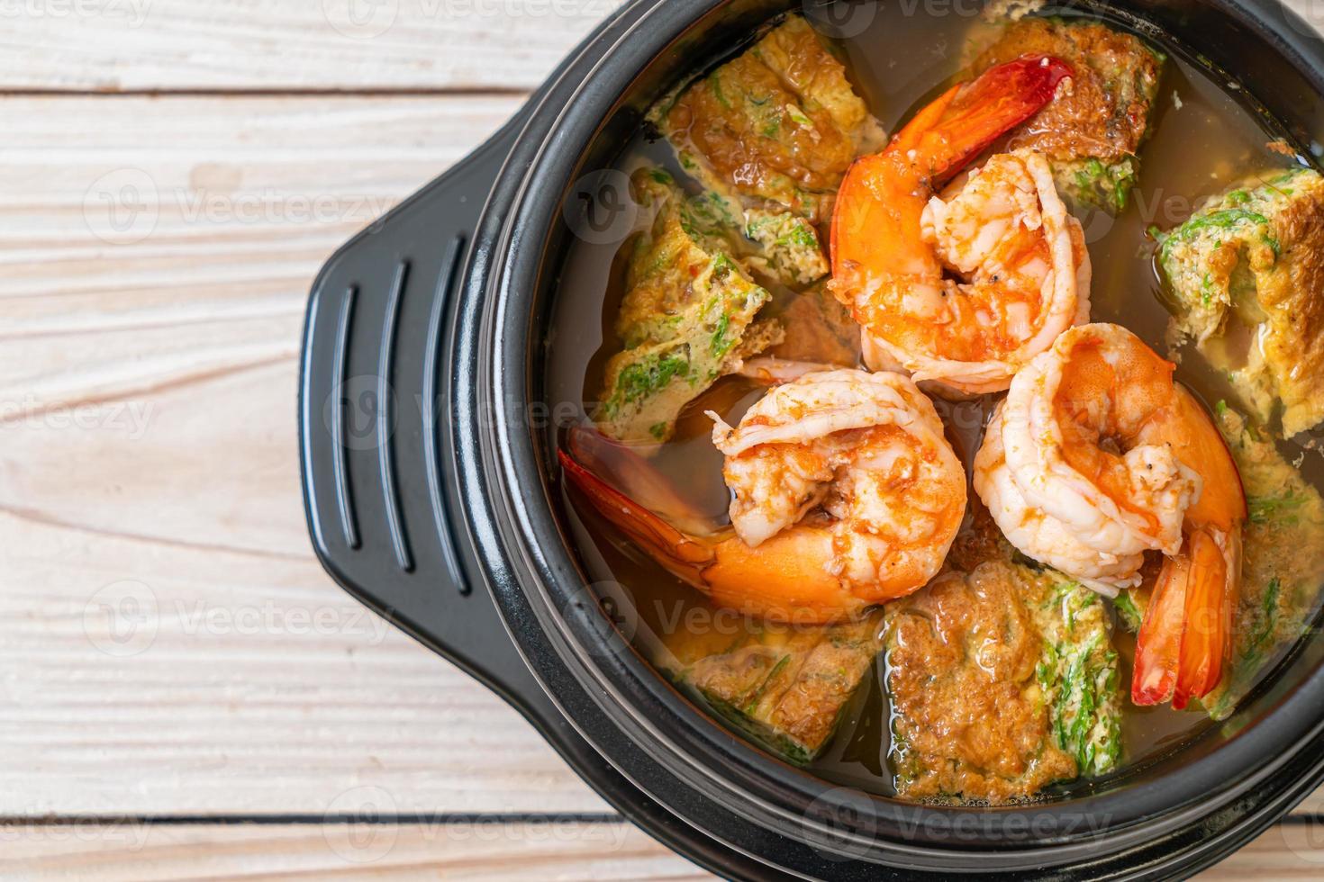 Sour soup made of Tamarind Paste with Shrimps and Vegetable Omelet photo