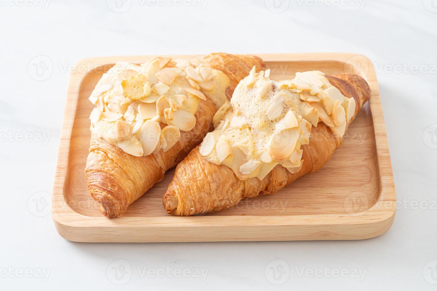 croissant with cream and almonds photo