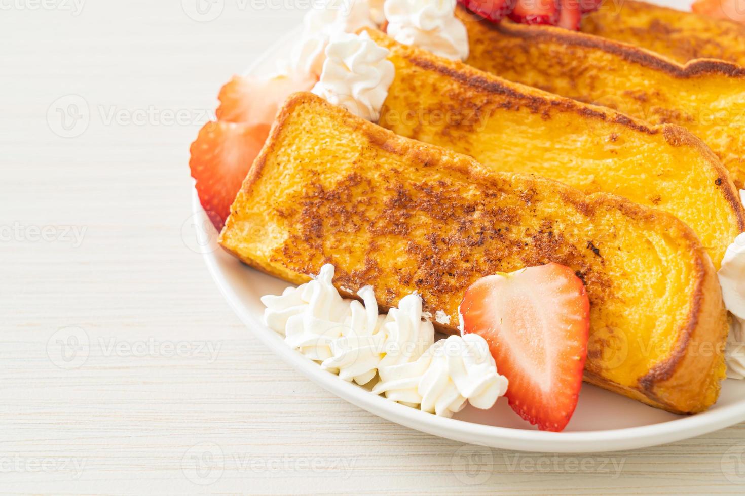 french toast with fresh strawberry and whipping cream photo