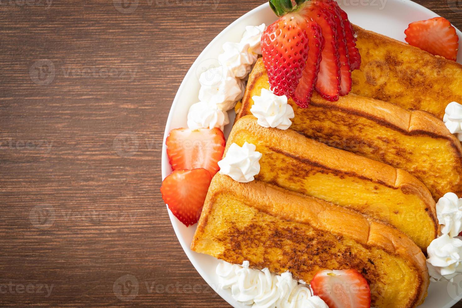 french toast with fresh strawberry and whipping cream photo