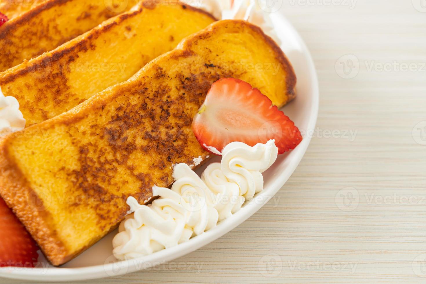 french toast with fresh strawberry and whipping cream photo