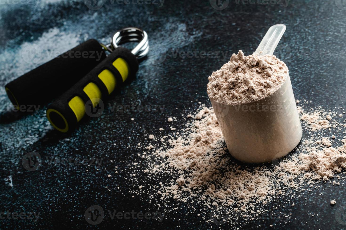 Scoop of Whey Protein in background. Sport nutrition. photo