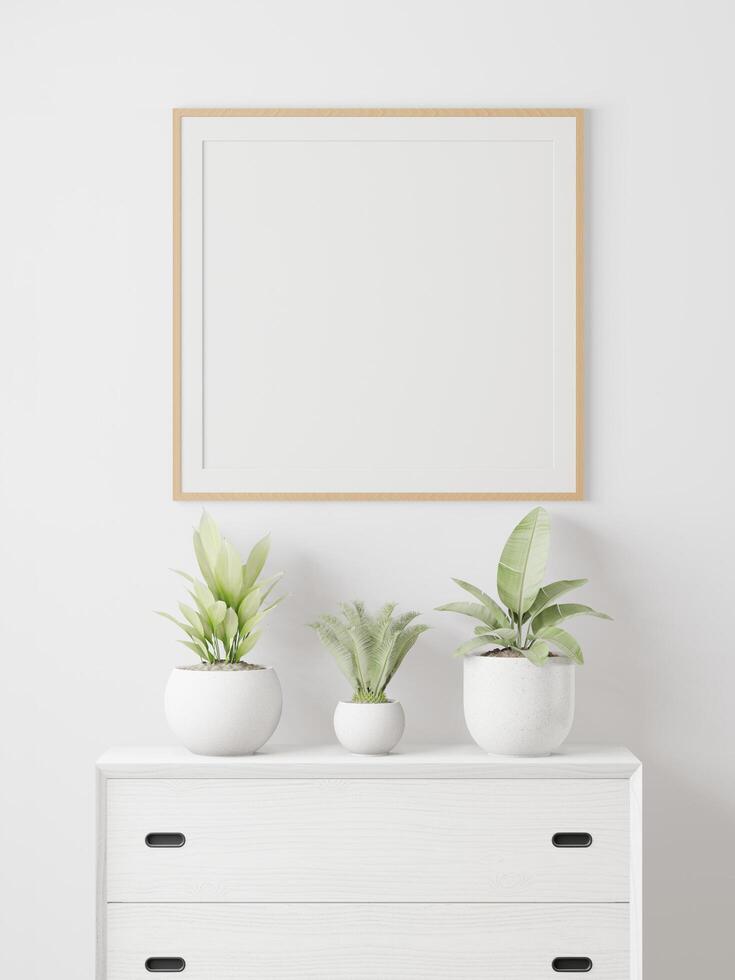 la sala está decorada con una mesa de almacenamiento, marcos para cuadros y macetas pequeñas. foto