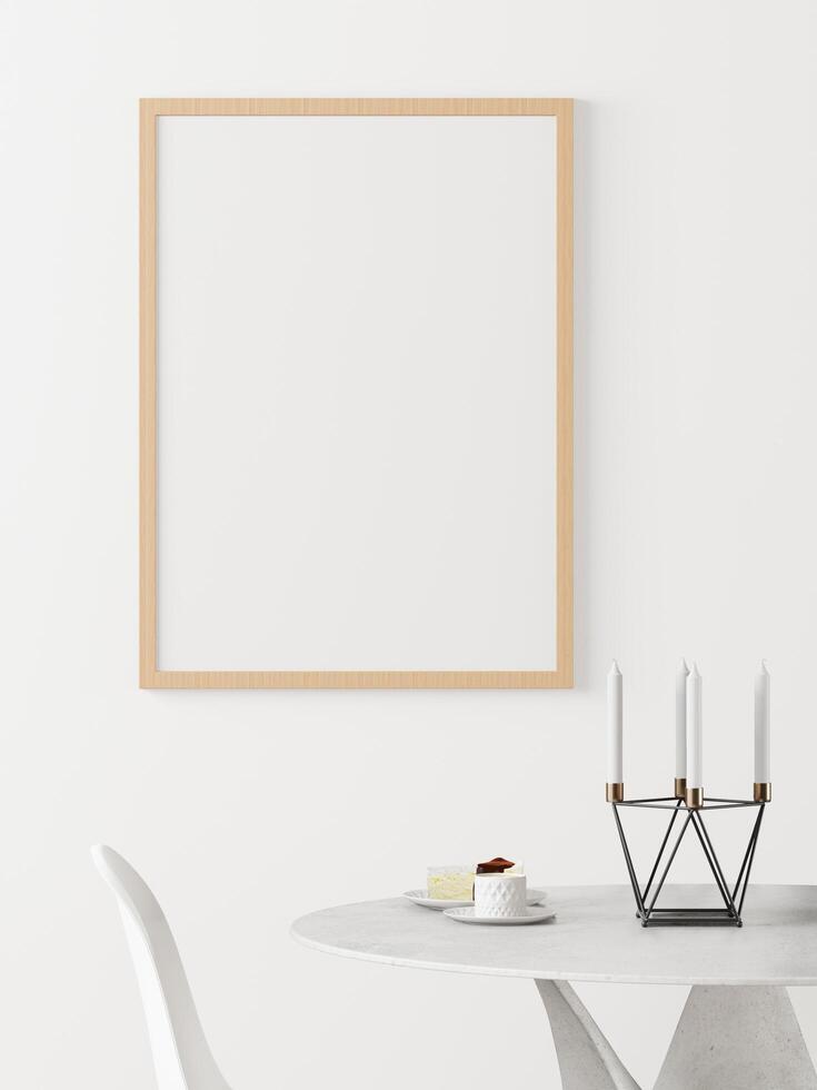 The living room is decorated with chairs, picture frames and flower vases. photo