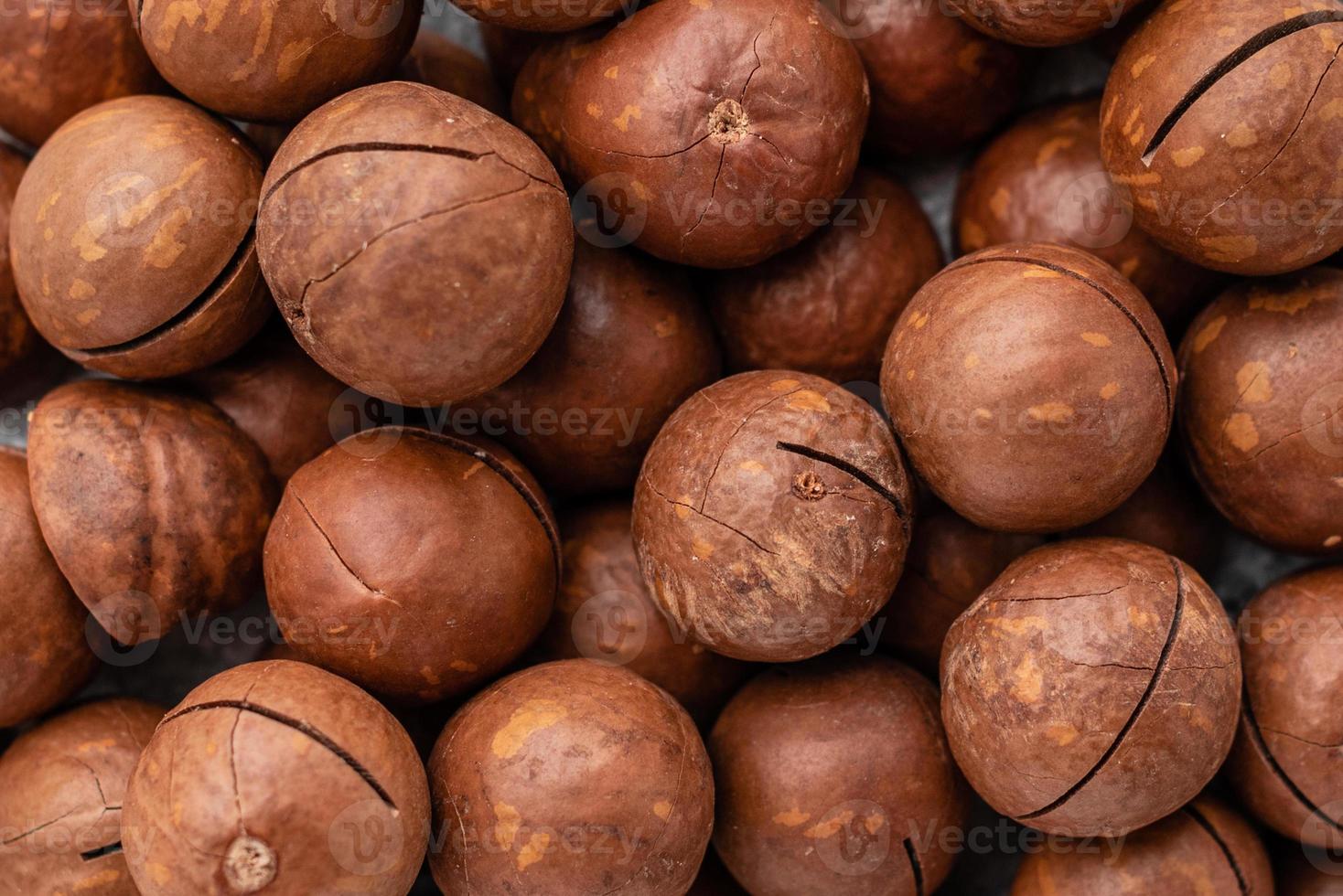nueces de macadamia de cerca. se puede utilizar como fondo foto