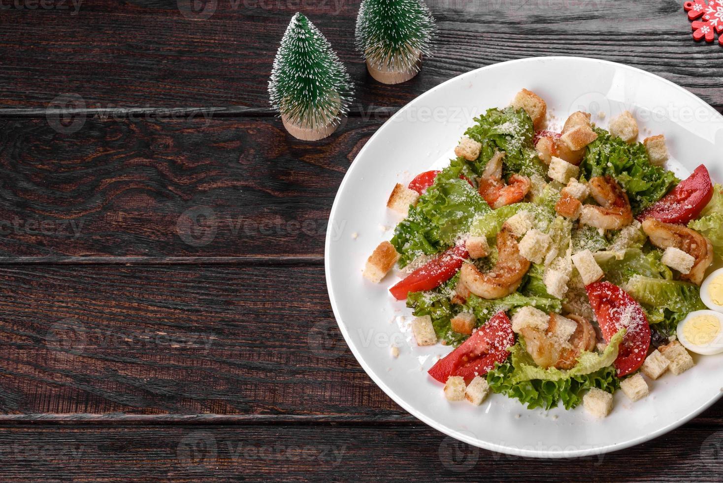 Tasty fresh salad prepared for the Christmas table photo