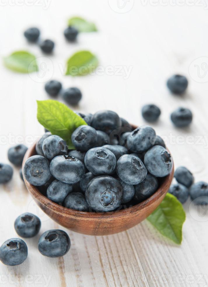 Blueberries on old wooden background photo