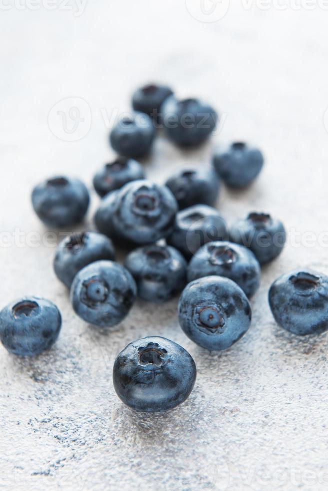 Blueberries on grey concrete background photo