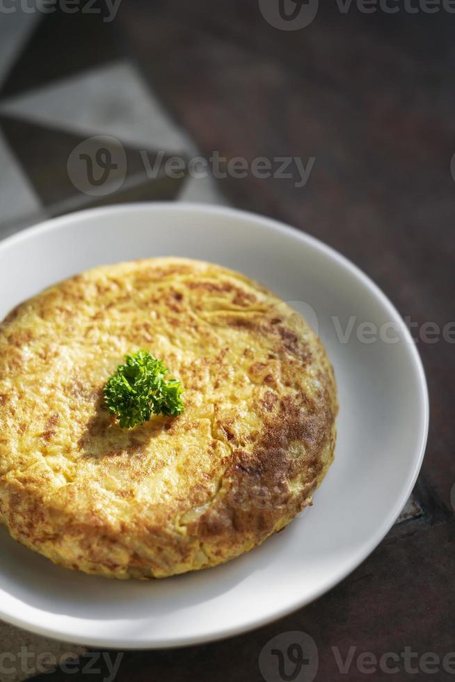 spanish tortilla omelet traditional tapas food on traditional rustic background photo