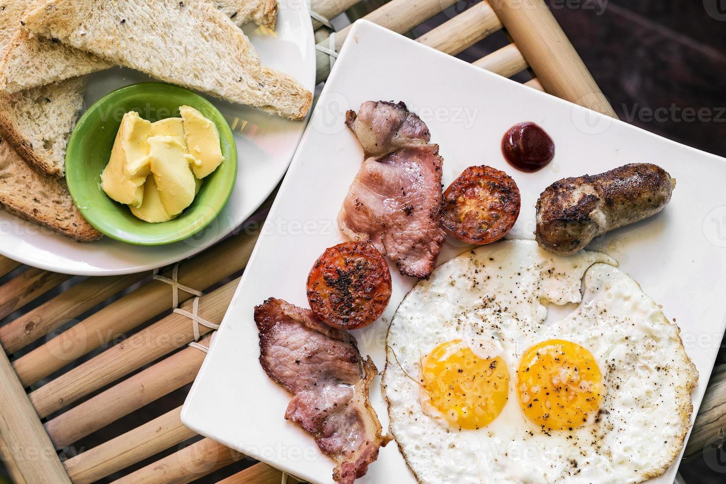 traditional english british fried breakfast with eggs bacon and sausage photo