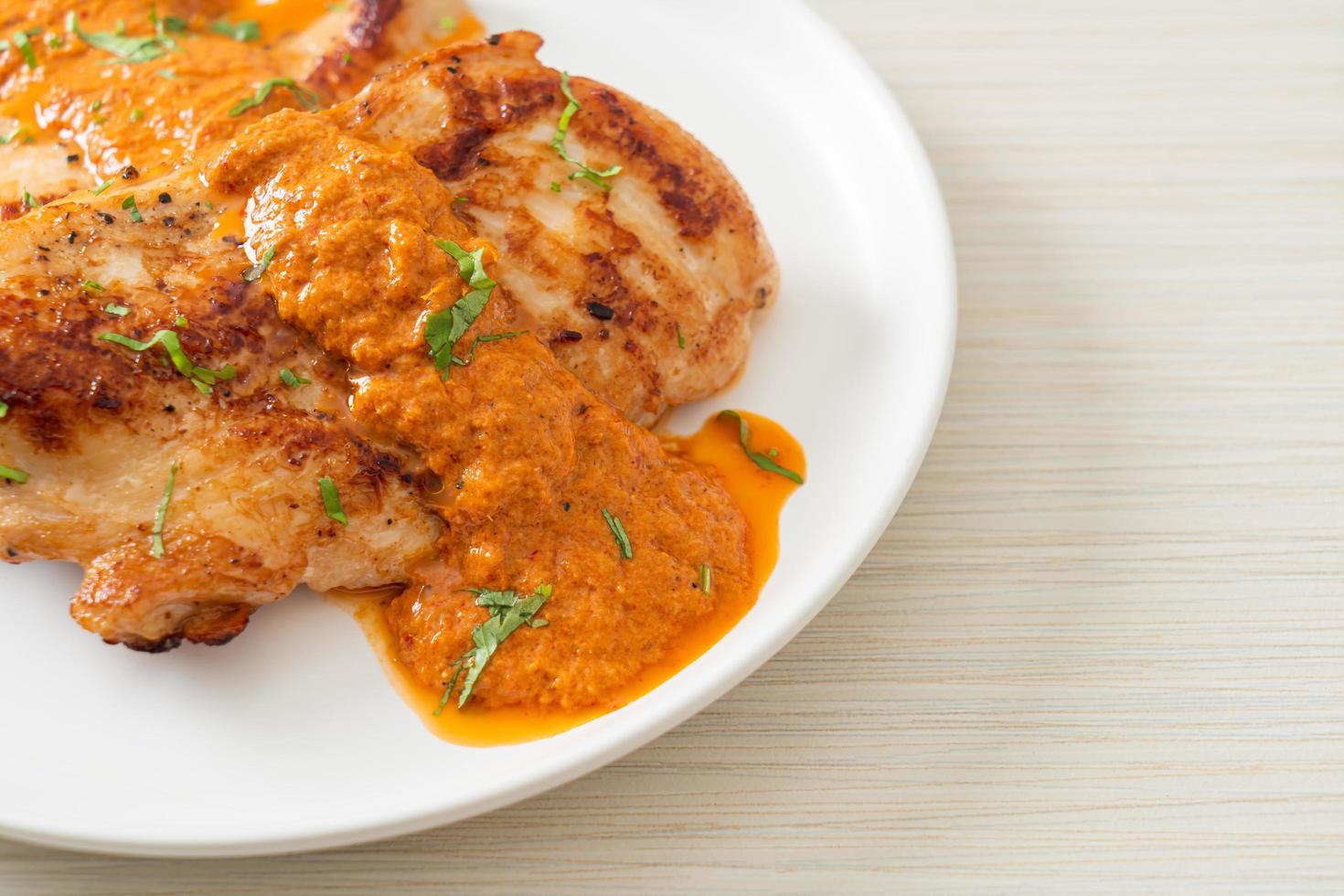 grilled chicken steak with red curry sauce photo