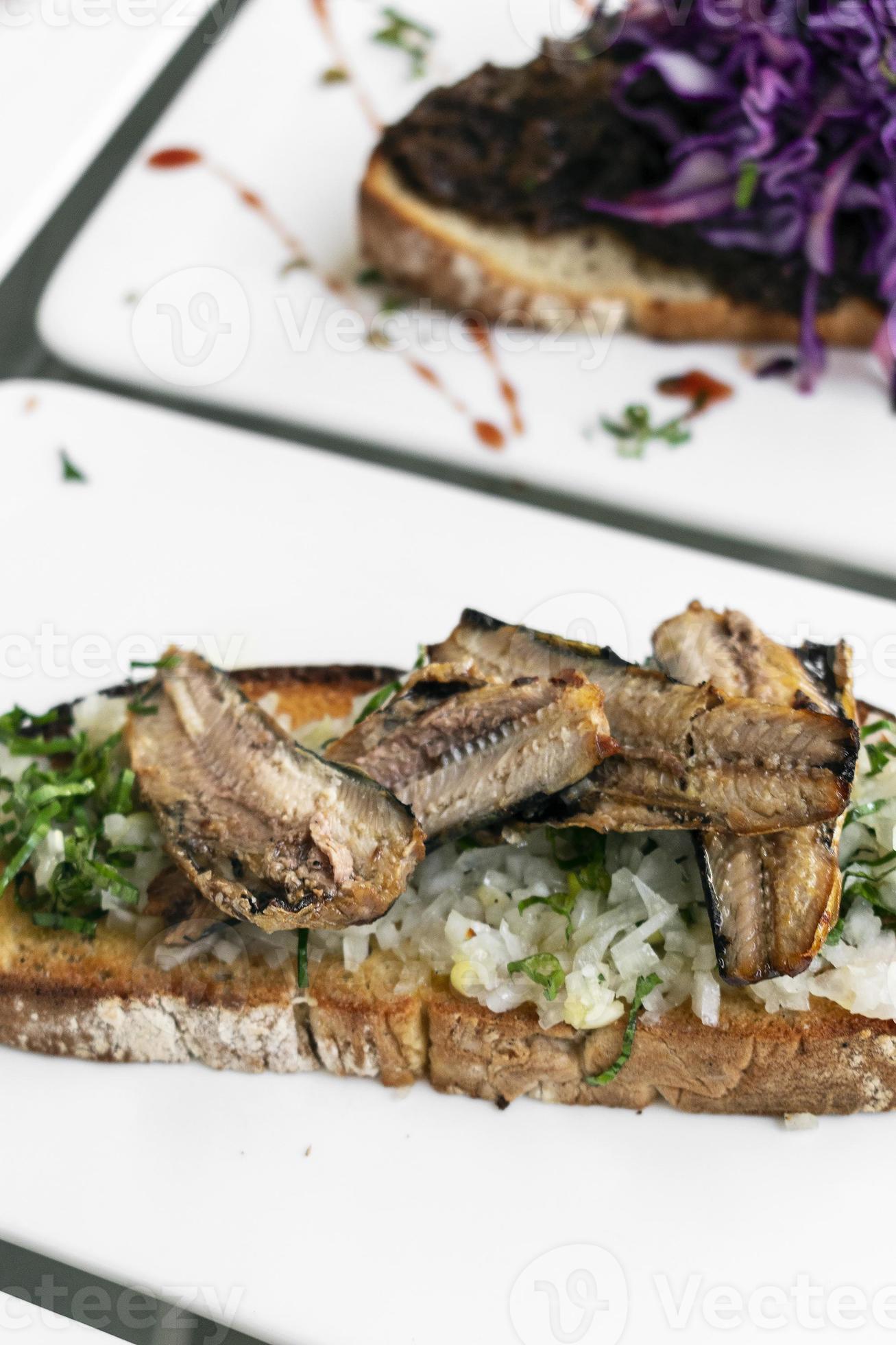 Portuguese tiborna open toast sandwich tapas with sardine and onion