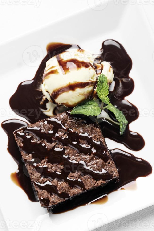 vegan chocolate brownie dessert with dairy-free vanilla ice cream photo