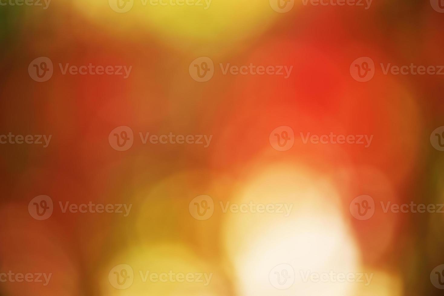Defocus light autumn background. Defocused beautiful bokeh with autumnal red and yellow leaves. photo