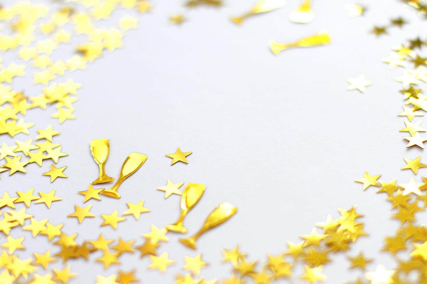 Festive background. Shining confetti stars on white background. Christmas. Wedding. Birthday. photo