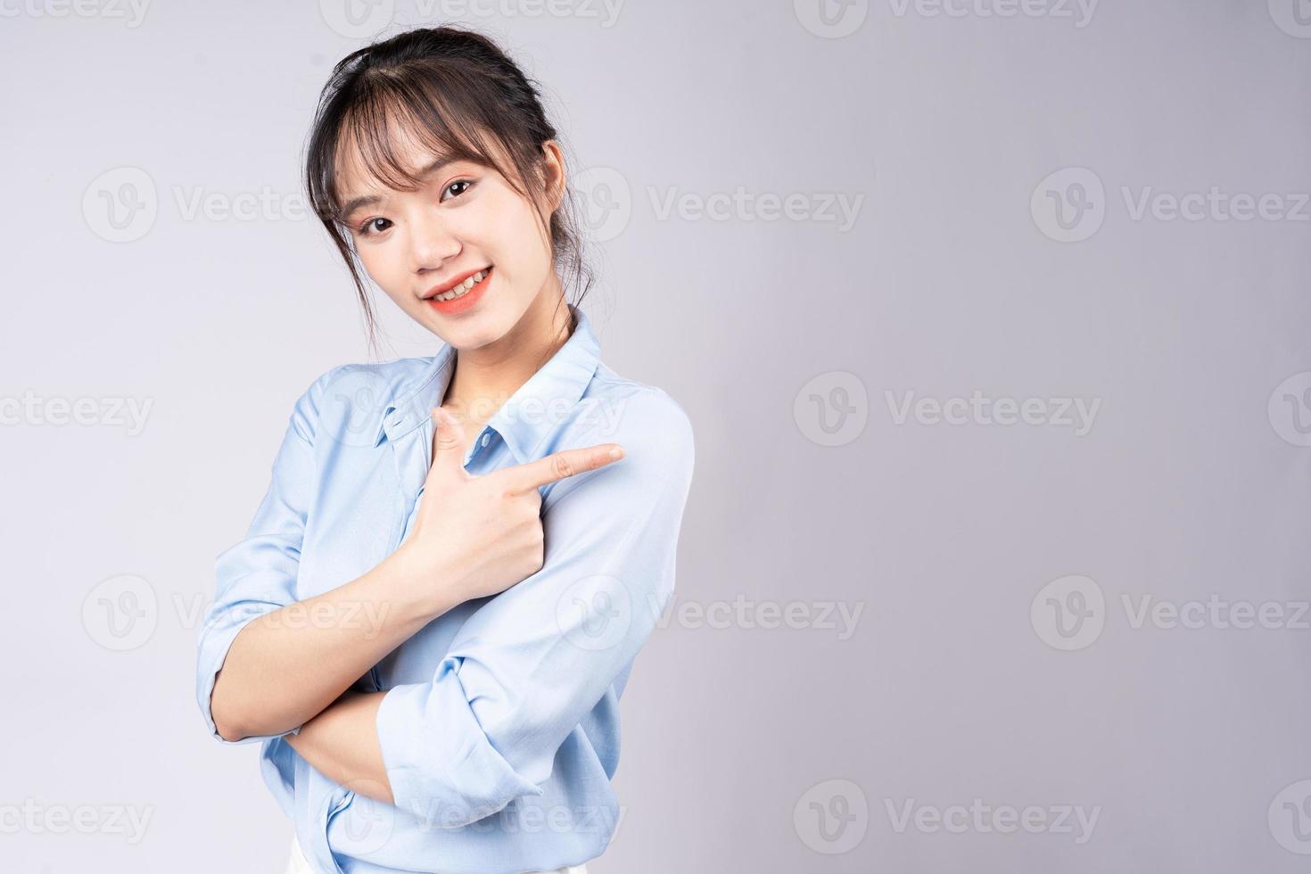 Portrait of young businesswoman on white background photo