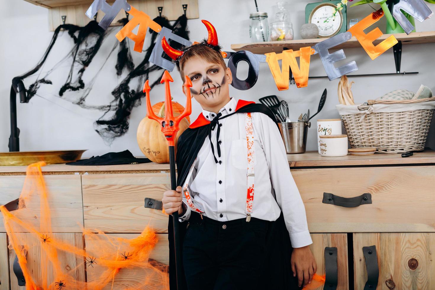 Boy standing  in fancy dress and looking out dreamly - Halloween concept photo