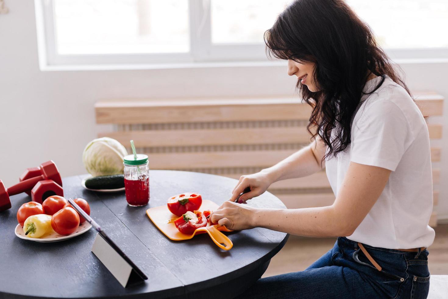 Attractive young woman preparing a delicious, wholesome lunch photo