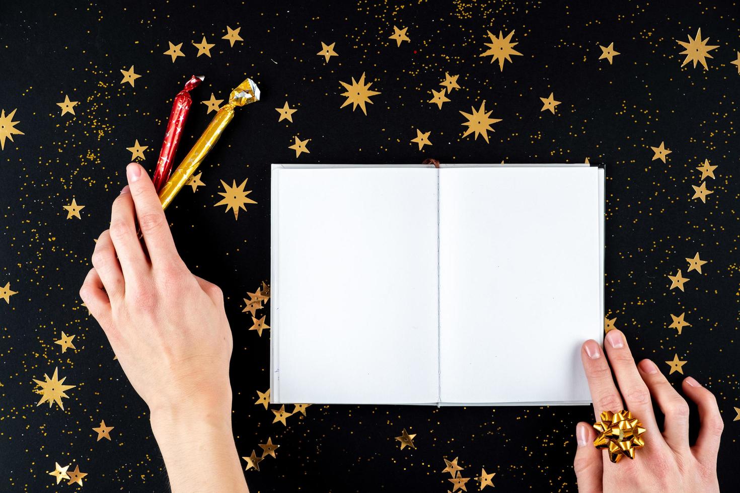 Female hands writing Christmas greeting letter photo