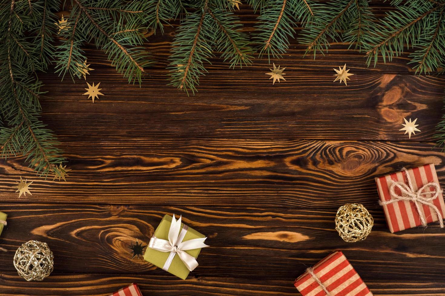 Christmas composition. Christmas gifts on wooden background photo