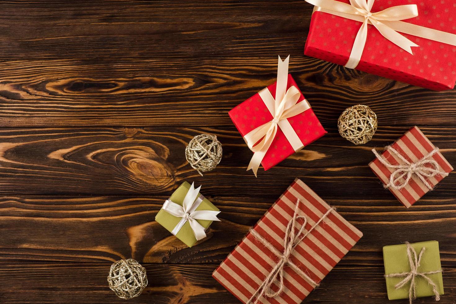 Gifts on wooden background, top view photo
