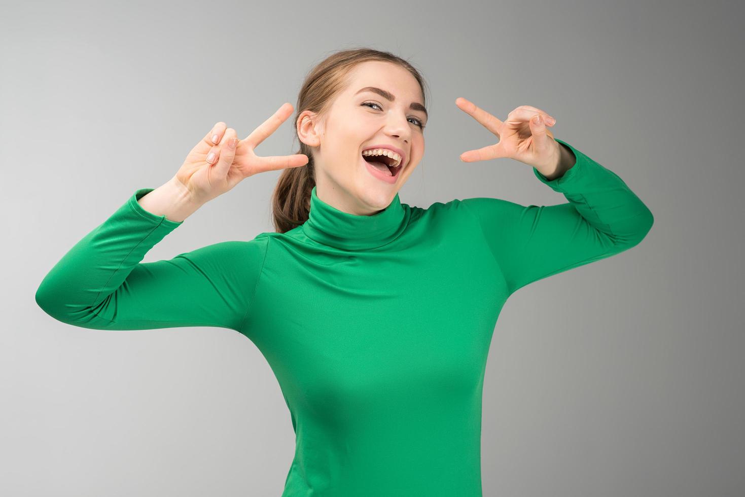Lifestyle and people concept- happy woman showing victory gesture. - Image photo