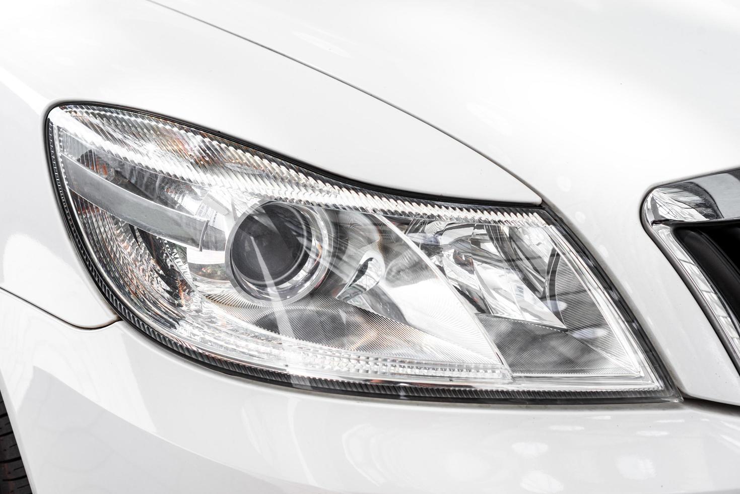 Modern car headlight, car exterior detail photo