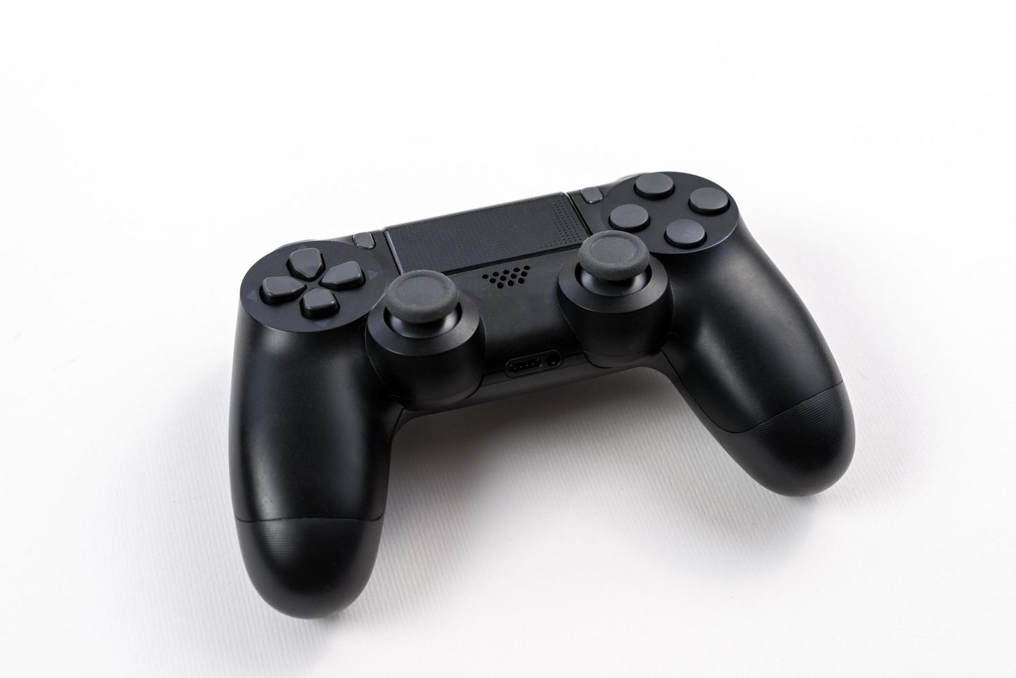 Black joystick isolated on a white background photo